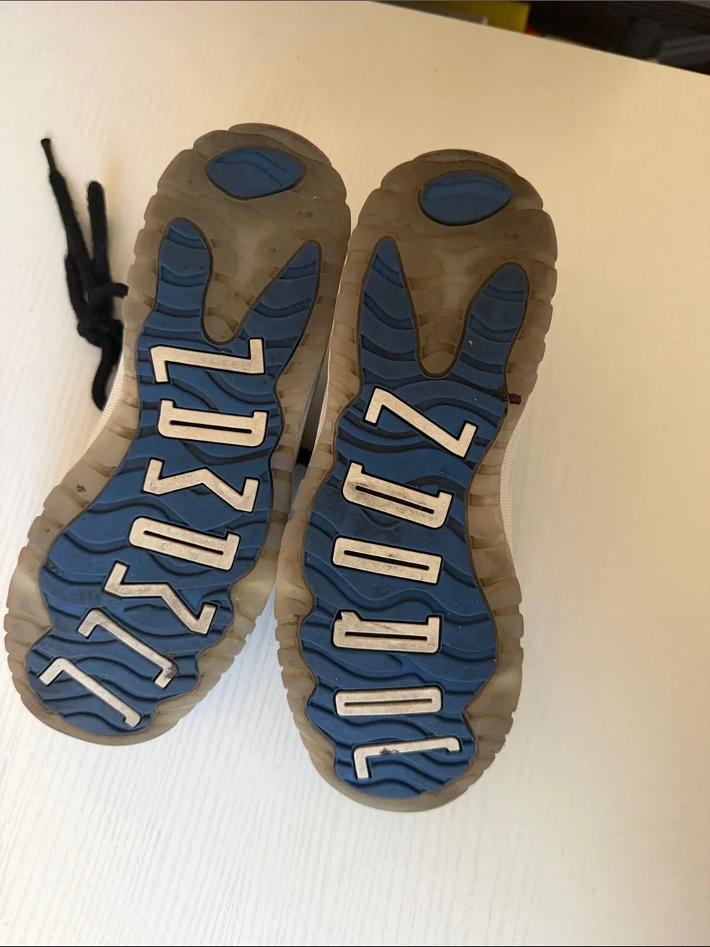 Jordan low 11’s Kids Black Basketball Sneakers with Blue Logo
